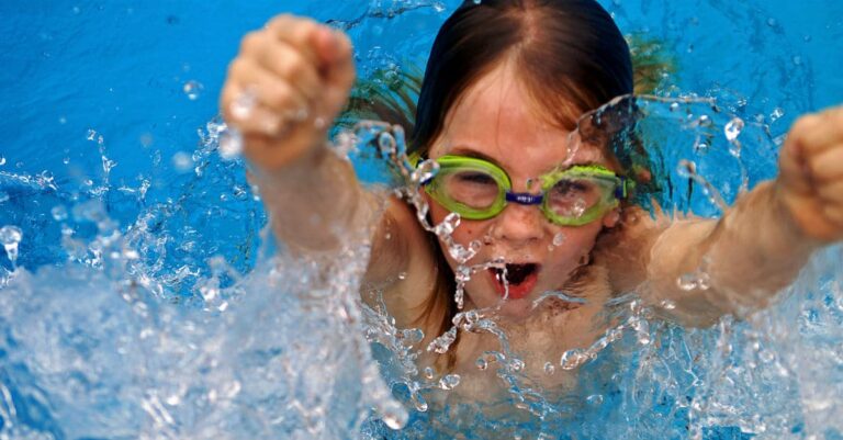 A little girl dives into water determined, surrounded by bubbles as we dive into 2015 SEO Ranking Factors.