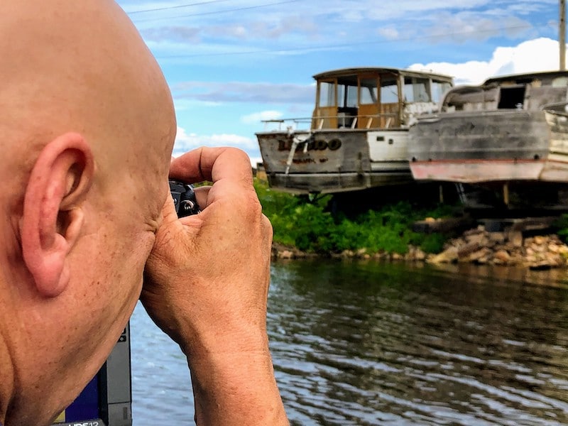 Marty takes a photo of two boats in dry dock.