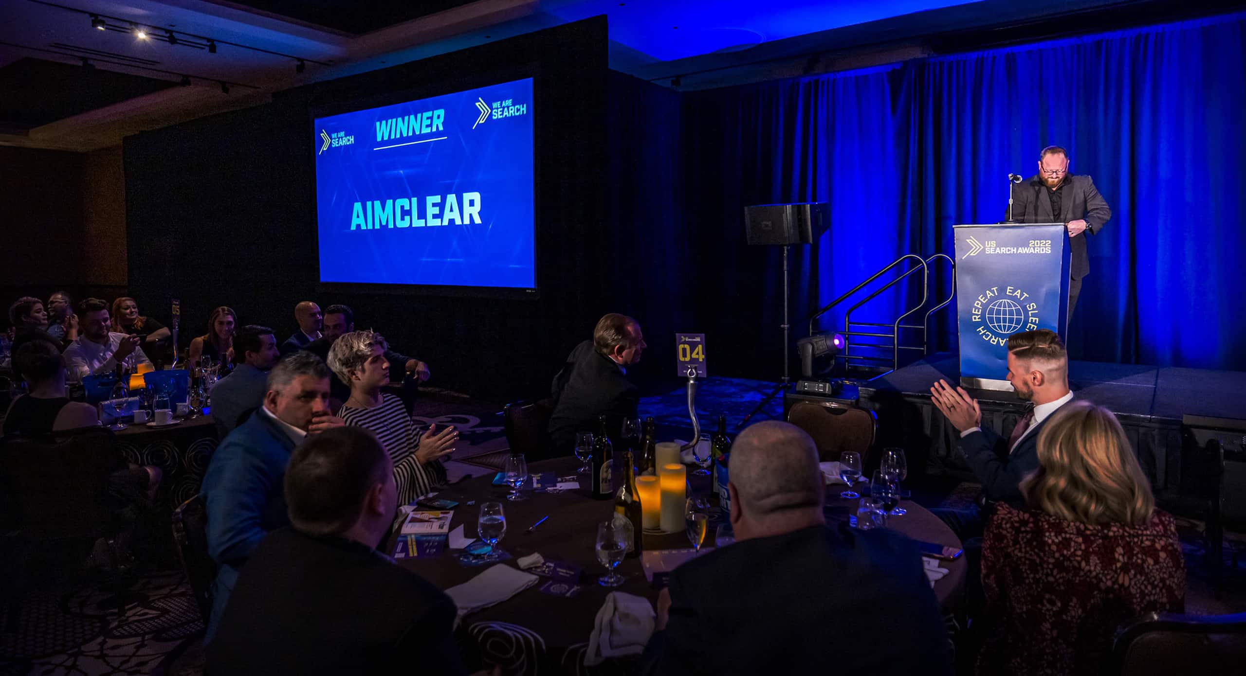 "Aimclear" appears on the big screen at the 2022 US Search Awards.