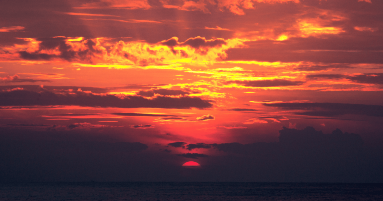 Image of a sunset turning the sky bright orange, in reference to the sunsetting of Universal Analytics.