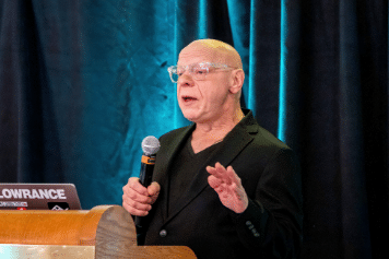 marty weintraub speaks at a conference